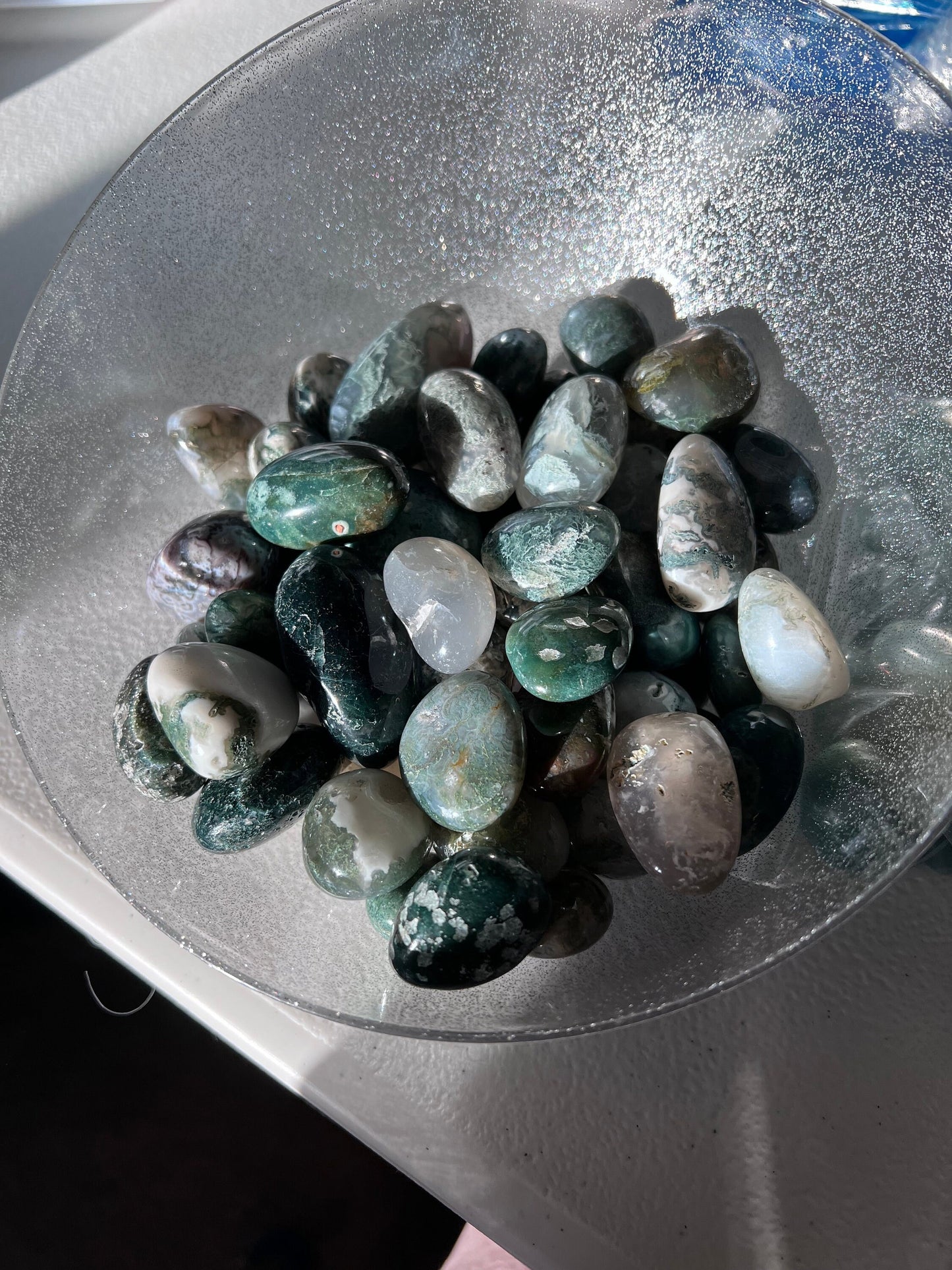 Stunning Moss Agate Crystal Tumbles in natural sunlight